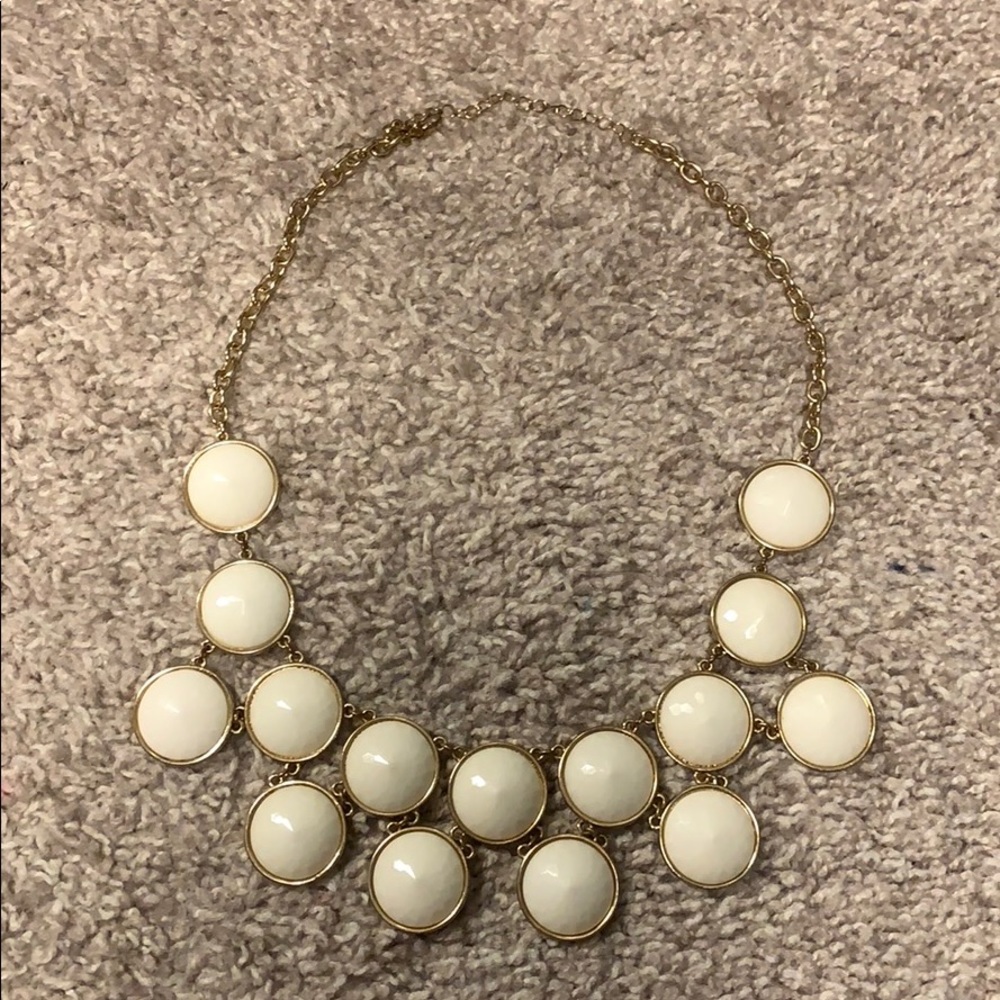 White and gold statement necklace.